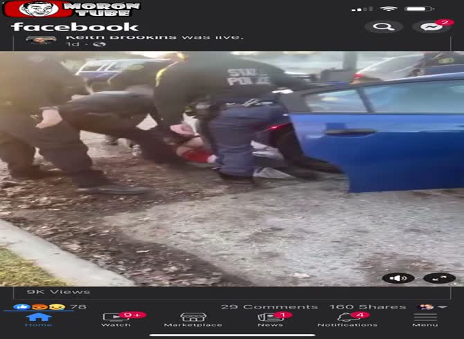 Video :One of the police officers becomes irate as a suspect refuses to get into a vehicle